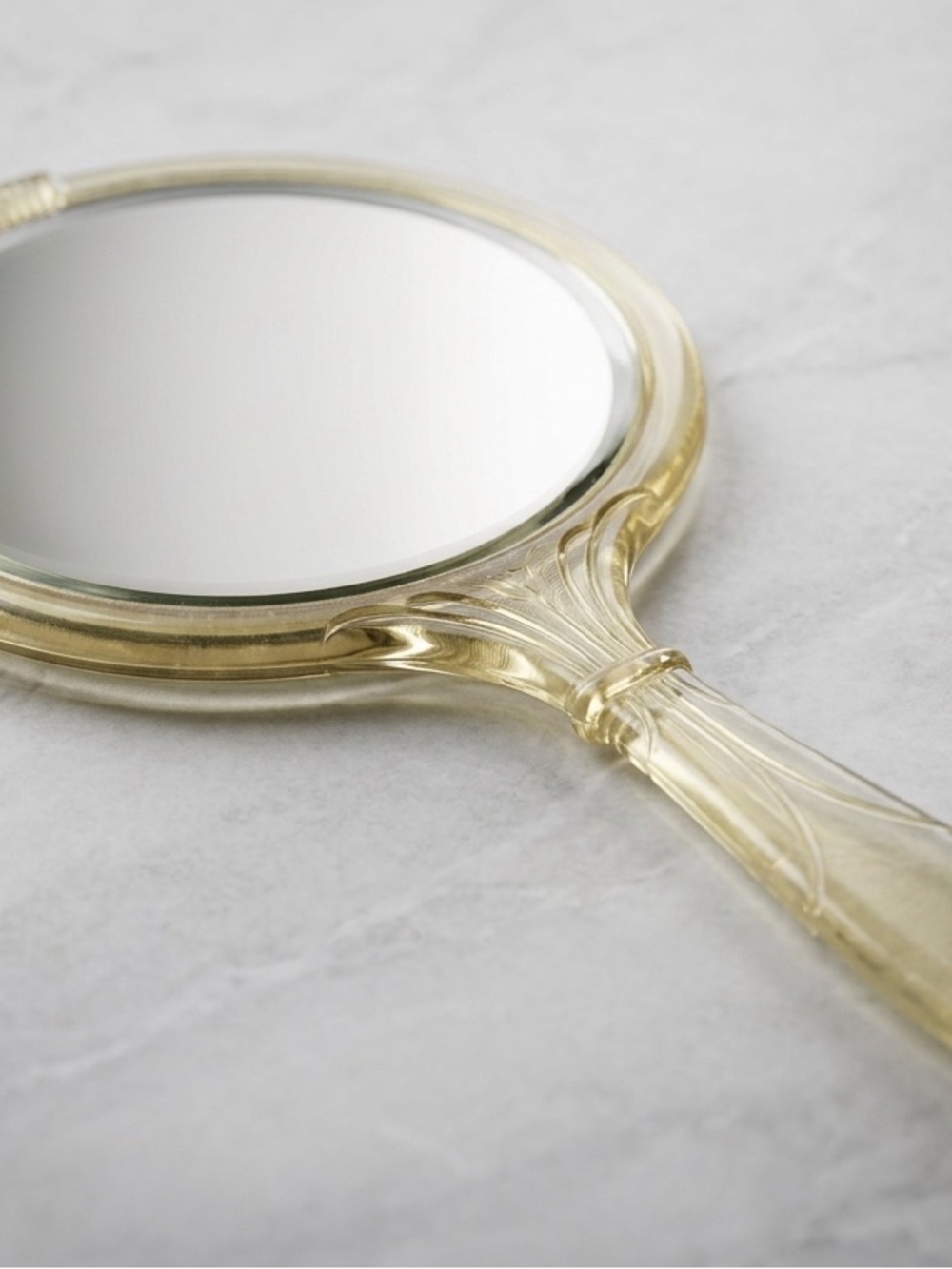 Vintage 1940s Celluloid Hand Mirror with Pale Yellow Guilloche Floral Motif
